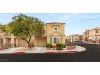 Inviting two-story home featuring a well-manicured lawn and a charming architectural design at 10437 Coyote Cub Ave, Las Vegas, NV 89129