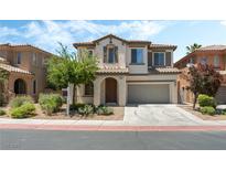 Charming two-story home with a well-maintained front yard, two-car garage, and traditional Southwest architecture at 11900 Calle De Sol Dr, Las Vegas, NV 89138