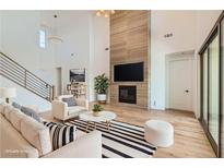 Bright living room with fireplace, TV, and stylish decor at 182 Robledo St, Las Vegas, NV 89138