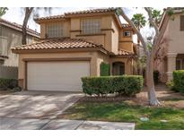 Charming two-story home with a well-maintained front yard and attached two-car garage at 1839 Thunder Mountain Dr, Henderson, NV 89012