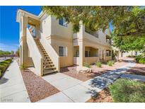 Attractive condo complex with well maintained landscape, sidewalks, and stairway leading to upper units at 1881 W Alexander Rd # 1092, North Las Vegas, NV 89032