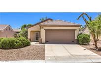 Charming single-story home featuring a neutral facade, desert landscaping, and an attached two-car garage at 2535 Leighton Ave, Henderson, NV 89052