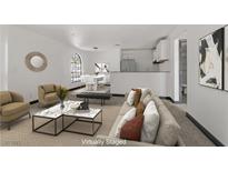Bright, staged living room with modern decor, neutral tones, and inviting furniture arrangement at 2963 Juniper Hills Blvd # 104, Las Vegas, NV 89142