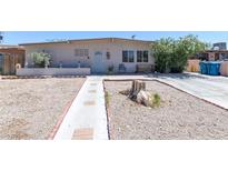 Charming single-story home featuring desert landscaping, a tidy yard, and a classic facade at 3212 Osage Ave, Las Vegas, NV 89101