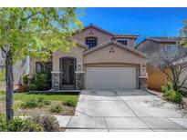 Charming two-story home with well-manicured landscaping and decorative stone accents at 3310 Hillside Garden Dr, Las Vegas, NV 89135