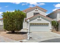 Charming two-story home featuring a two-car garage and a well-maintained front yard with mature landscaping at 3632 Julia Waldene Ct, Las Vegas, NV 89129