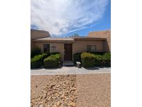 Charming single-story home with a well-maintained front yard and inviting entrance at 4238 Rollingstone Dr, Las Vegas, NV 89103