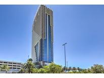 Modern high-rise building featuring sleek architecture and expansive windows under a clear blue sky at 4381 W Flamingo Rd # 1905, Las Vegas, NV 89103