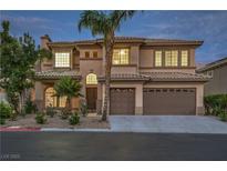 Elegant two-story home featuring a three-car garage, desert landscaping, and a stately entrance at 4664 Stuttgart St, Las Vegas, NV 89147