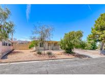 Charming single-story home with desert landscaping and a covered porch, perfect for relaxing outdoors at 6 Montana Way, Henderson, NV 89015