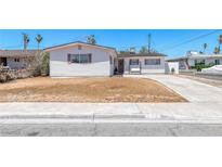 Charming single-story home featuring a clean white exterior with brown window shutters and a well-maintained lawn at 6204 Parsifal Pl, Las Vegas, NV 89107