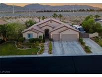 Beautiful one story home with a three car garage and well-manicured landscaping at 6245 Galileo Dr, Las Vegas, NV 89149