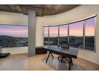 Bright office space with large windows showcasing a stunning city view and modern desk at 900 Las Vegas Blvd # 912, Las Vegas, NV 89101