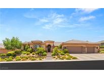 Stunning single-story home featuring a tile roof, manicured landscaping and a three car garage at 9747 Cathedral Pines Ave, Las Vegas, NV 89149