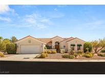 Charming single-story home featuring a well-maintained yard with desert landscaping and attached two-car garage at 10548 Findlay Ave, Las Vegas, NV 89134