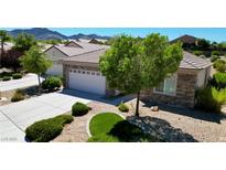 Well-maintained home with low-maintenance landscaping, stone accents, and a spacious driveway at 2535 Jada Dr, Henderson, NV 89044