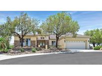 Charming single-story home featuring desert landscaping and a spacious three-car garage at 2899 Brook Trout Ct, Henderson, NV 89052