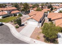 Inviting single-story home featuring desert landscaping and a classic red tile roof at 317 Brent Ct, Henderson, NV 89074