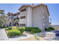 Condominium exterior featuring a well-maintained building, landscaping, and exterior stairs at 4200 S Valley View Blvd # 1120, Las Vegas, NV 89103