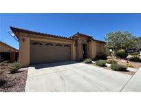 Beautiful single-story home with a two-car garage, stone accents, and well-maintained landscaping at 4732 S Adriano Way, Pahrump, NV 89061