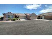 Charming single story home with a well maintained lawn and an attached two car garage at 4841 Raw Umber Ct, Las Vegas, NV 89131