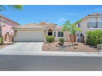 Inviting single-story home featuring a two-car garage, neutral paint scheme and desert landscaping at 5732 Hornbrook St, North Las Vegas, NV 89031