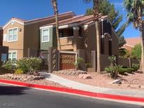 Condo exterior with mature landscaping and desert themed rock covering at 8101 W Flamingo Rd # 1102, Las Vegas, NV 89147