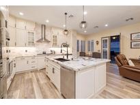 Bright kitchen featuring granite countertops, stainless steel appliances, and a stylish island at 8149 Villa De La Playa St, Las Vegas, NV 89131