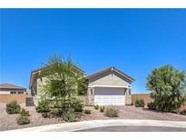Charming single-story home featuring a two-car garage and desert landscaping at 879 Klamath Springs St, Henderson, NV 89011