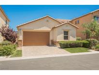 Charming single-story home featuring a two-car garage and a well-manicured front lawn at 12426 Mosticone Way, Las Vegas, NV 89141