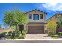 Charming two-story home features a landscaped front yard and a two-car garage with brick paved driveway at 3949 Amanda Bay Ave, North Las Vegas, NV 89081