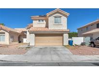 Charming two-story home featuring a neutral stucco exterior and a convenient two-car attached garage at 5612 Royal Castle Ln, Las Vegas, NV 89130