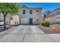 Two-story home featuring desert landscaping, a garage, and a concrete driveway on a sunny day at 6377 W Haleh Ave, Las Vegas, NV 89141