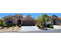 Charming single-story home with a well-manicured front yard and a two-car garage at 7395 Howell Mill Ct, Las Vegas, NV 89113