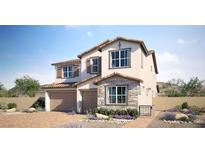 Charming two-story home with stone accents, two-car garage, tile roof, and a beautifully landscaped front yard at 769 Cloud Creek St, Henderson, NV 89011