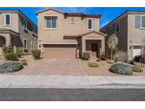 Inviting two-story home features a two-car garage, manicured landscaping, and a covered front porch entry at 9850 Poplar Point Ave, Las Vegas, NV 89178