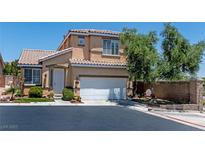 Charming two-story home featuring a well-maintained yard and a two-car garage at 10352 Natural Springs Ave, Las Vegas, NV 89129