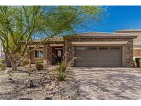 Beautiful single-story home with a stone facade and well-maintained desert landscaping at 1304 Fantastic Ct, North Las Vegas, NV 89081