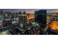 Breathtaking aerial view of the city skyline featuring multiple high rise residences and surrounding establishments at dusk at 145 E Harmon Ave # 3705, Las Vegas, NV 89109