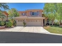 Charming two-story home with a three-car garage, desert landscaping, and a well-maintained lawn at 229 N Buteo Woods Ln, Las Vegas, NV 89144