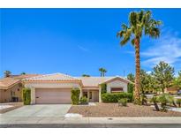 Charming single story home with a two-car garage and a well-manicured front yard with desert landscaping at 2413 Rockford St, Las Vegas, NV 89134