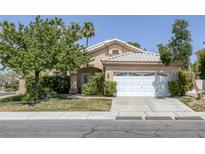Charming single-story home with a well-maintained front yard and a two-car garage at 2528 Huber Heights Dr, Las Vegas, NV 89128