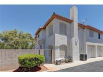 Charming two-story townhome featuring classic stucco and a terra cotta roofline in a quiet neighborhood at 278 Star Cluster Cir, Las Vegas, NV 89145