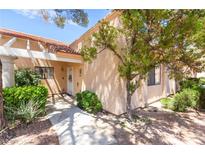 Inviting front entrance with a trellis and a well-maintained garden, creating a welcoming curb appeal at 2851 S Valley View Blvd # 1071, Las Vegas, NV 89102