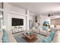 Bright living room featuring modern furniture, a large screen television, and neutral decor at 3640 Shanagolden St, Las Vegas, NV 89129
