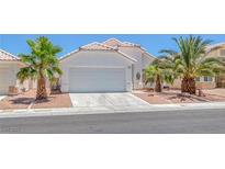 Charming single-story home with a well-maintained front yard and a two-car garage at 4420 Loma Ct, Las Vegas, NV 89130