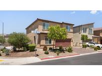Inviting two-story home featuring a desert landscape and a two-car garage at 4498 Lantern Point Ave, North Las Vegas, NV 89084