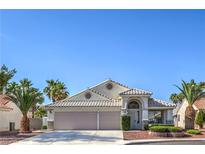 Charming single-story home with a tile roof, arched entryway, and a well-maintained front yard at 5425 Thomaston Ct, Las Vegas, NV 89122