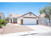 Charming single-story home with a well-maintained front yard, desert landscaping and a two car garage at 7231 Sequoia Springs Dr, Las Vegas, NV 89147