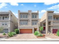 Contemporary three-story home featuring a garage and low-maintenance landscaping at 8072 Haywood Estate, Las Vegas, NV 89113